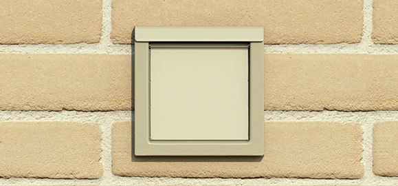 Low profile dryer wall cap with backdraft damper